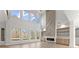 Spacious living room with tall windows, modern fireplace and custom shelving at 1540 Brooks S Rd, Lawrenceville, GA 30045