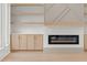 An open living room with custom shelving and a modern fireplace feature at 1540 Brooks S Rd, Lawrenceville, GA 30045