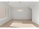 Elegant living room featuring hardwood floors, luxury lighting fixture and wainscotting at 1540 Brooks S Rd, Lawrenceville, GA 30045