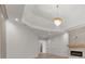 Bright living room with tray ceiling, modern fireplace, and elegant chandelier at 1540 Brooks S Rd, Lawrenceville, GA 30045