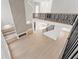 Open-concept living room featuring a modern fireplace, built-in shelving, hardwood floors, and high ceilings at 1540 Brooks S Rd, Lawrenceville, GA 30045