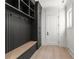 Mudroom area with custom built-in storage, a bench, and natural light from a nearby window at 1540 Brooks S Rd, Lawrenceville, GA 30045
