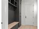 A mudroom with built-in storage, seating, and hooks, providing organization near the entrance at 1540 Brooks S Rd, Lawrenceville, GA 30045