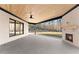 Covered patio with a stone fireplace, ceiling fan, and backyard view at 1540 Brooks S Rd, Lawrenceville, GA 30045