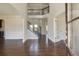 View of the home's foyer with hardwood floors and an staircase with iron railings at 1993 Side Branch Way, Lawrenceville, GA 30045