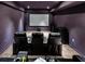 Home theater room with reclining chairs, large screen, and surround sound speakers at 1993 Side Branch Way, Lawrenceville, GA 30045