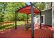 Inviting backyard deck with pergola, seating, and a peaceful setting at 605 Sutton Sw Way, Marietta, GA 30064
