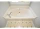 Close up of a clean, cream-colored bathtub with chrome fixtures and tiled flooring at 605 Sutton Sw Way, Marietta, GA 30064
