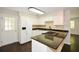 Modern kitchen with white cabinets, granite countertops, a breakfast bar, and stainless steel appliances at 605 Sutton Sw Way, Marietta, GA 30064
