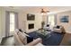 Inviting living room with a fireplace, comfortable seating, and natural light at 605 Sutton Sw Way, Marietta, GA 30064