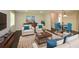 Comfortable living room featuring plush seating, a decorative rug, and stylish décor, with a view into the dining room at 605 Sutton Sw Way, Marietta, GA 30064