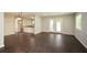 Bright and airy living room with hardwood floors and double doors leading to the backyard at 605 Sutton Sw Way, Marietta, GA 30064