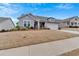 Attractive one-story house featuring a two-car garage and an American flag in the yard at 242 Cordova St, Woodstock, GA 30189