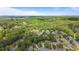 Expansive aerial showcases a verdant community dotted with residences and scenic treelines at 3105 Birchton St, Johns Creek, GA 30022
