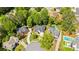 Aerial view showcasing the home's location within a lush, green, and established neighborhood at 3105 Birchton St, Johns Creek, GA 30022