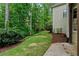 Lush backyard with mature trees, landscaping, and patio at 3105 Birchton St, Johns Creek, GA 30022