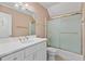 Well-lit bathroom with a tub shower and a white vanity with chrome fixtures and hardware at 3105 Birchton St, Johns Creek, GA 30022