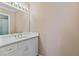 Bright bathroom features a white vanity with a large mirror and modern lighting fixtures at 3105 Birchton St, Johns Creek, GA 30022