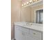Bright bathroom features a white vanity with a large mirror and modern lighting fixtures at 3105 Birchton St, Johns Creek, GA 30022