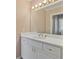 Updated bathroom with a large mirror, white vanity, chrome fixtures, and decorative pulls at 3105 Birchton St, Johns Creek, GA 30022