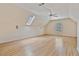 Spacious bedroom with hardwood floors, vaulted ceilings, natural light, and a ceiling fan at 3105 Birchton St, Johns Creek, GA 30022