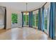 Dining room with direct access to the back deck, large bay window, and hardwood floors at 3105 Birchton St, Johns Creek, GA 30022