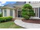 Inviting home entrance with a stone pathway leading to elegant front doors and manicured landscaping at 3105 Birchton St, Johns Creek, GA 30022