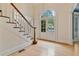 Foyer featuring a staircase and arched front door at 3105 Birchton St, Johns Creek, GA 30022