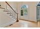 Foyer with staircase and double doors providing ample natural light at 3105 Birchton St, Johns Creek, GA 30022