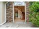 Grand foyer entrance with stone accents, hardwood floors, and elegant staircase visible from the front door at 3105 Birchton St, Johns Creek, GA 30022