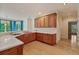 Kitchen area with wooden cabinets and white countertops at 3105 Birchton St, Johns Creek, GA 30022