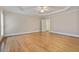 Spacious main bedroom features hardwood floors, tray ceiling, and bright windows at 3105 Birchton St, Johns Creek, GA 30022