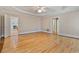 Large main bedroom with hardwood floors, tray ceiling, and natural light at 3105 Birchton St, Johns Creek, GA 30022