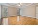 Large main bedroom features hardwood floors, tray ceiling, and bright windows at 3105 Birchton St, Johns Creek, GA 30022