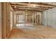 Unfinished basement showing the layout with wooden framing and potential for expansion at 3294 Mill Forest Dr, Conyers, GA 30094