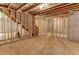 Unfinished basement featuring exposed beams and a wooden framework, offering customization potential at 3294 Mill Forest Dr, Conyers, GA 30094