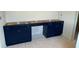 Bathroom vanity with dark blue cabinets, ready for countertops and plumbing fixtures at 3294 Mill Forest Dr, Conyers, GA 30094