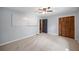 Bedroom with neutral walls and plush carpet, offering a relaxing atmosphere at 3400 Bonds Lake Nw Rd, Conyers, GA 30012