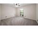 Bedroom with a private balcony for enjoying peaceful mornings or relaxing evenings at 3400 Bonds Lake Nw Rd, Conyers, GA 30012