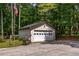 Detached garage with ample parking space and bench at 3400 Bonds Lake Nw Rd, Conyers, GA 30012