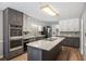 Spacious kitchen featuring granite countertops, stainless steel appliances, and dark cabinets at 3400 Bonds Lake Nw Rd, Conyers, GA 30012