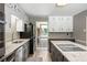 Modern kitchen with an island cooktop, granite countertops, and stainless steel appliances at 3400 Bonds Lake Nw Rd, Conyers, GA 30012
