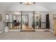 Bright and open living area with gray carpet and walls, divided by black columns at 3400 Bonds Lake Nw Rd, Conyers, GA 30012