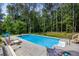 Enjoy this refreshing in-ground pool and spacious patio, perfect for entertaining at 3400 Bonds Lake Nw Rd, Conyers, GA 30012