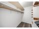 Walk-in closet with shelving and laminate flooring to keep items organized and accessible at 3400 Bonds Lake Nw Rd, Conyers, GA 30012