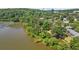 Scenic aerial shot showcasing the riverfront property with lush trees at 1021 Riverbend Club Se Dr, Atlanta, GA 30339