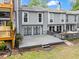 View of rear townhome exteriors with multiple balconies and patios at 1021 Riverbend Club Se Dr, Atlanta, GA 30339