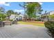 Outdoor deck area offering views of the surrounding lush green lawn at 1021 Riverbend Club Se Dr, Atlanta, GA 30339