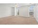 Large bedroom with carpet and natural light from two windows at 1021 Riverbend Club Se Dr, Atlanta, GA 30339