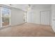 Spacious bedroom with neutral carpet, ceiling fan, and double closets at 1021 Riverbend Club Se Dr, Atlanta, GA 30339
